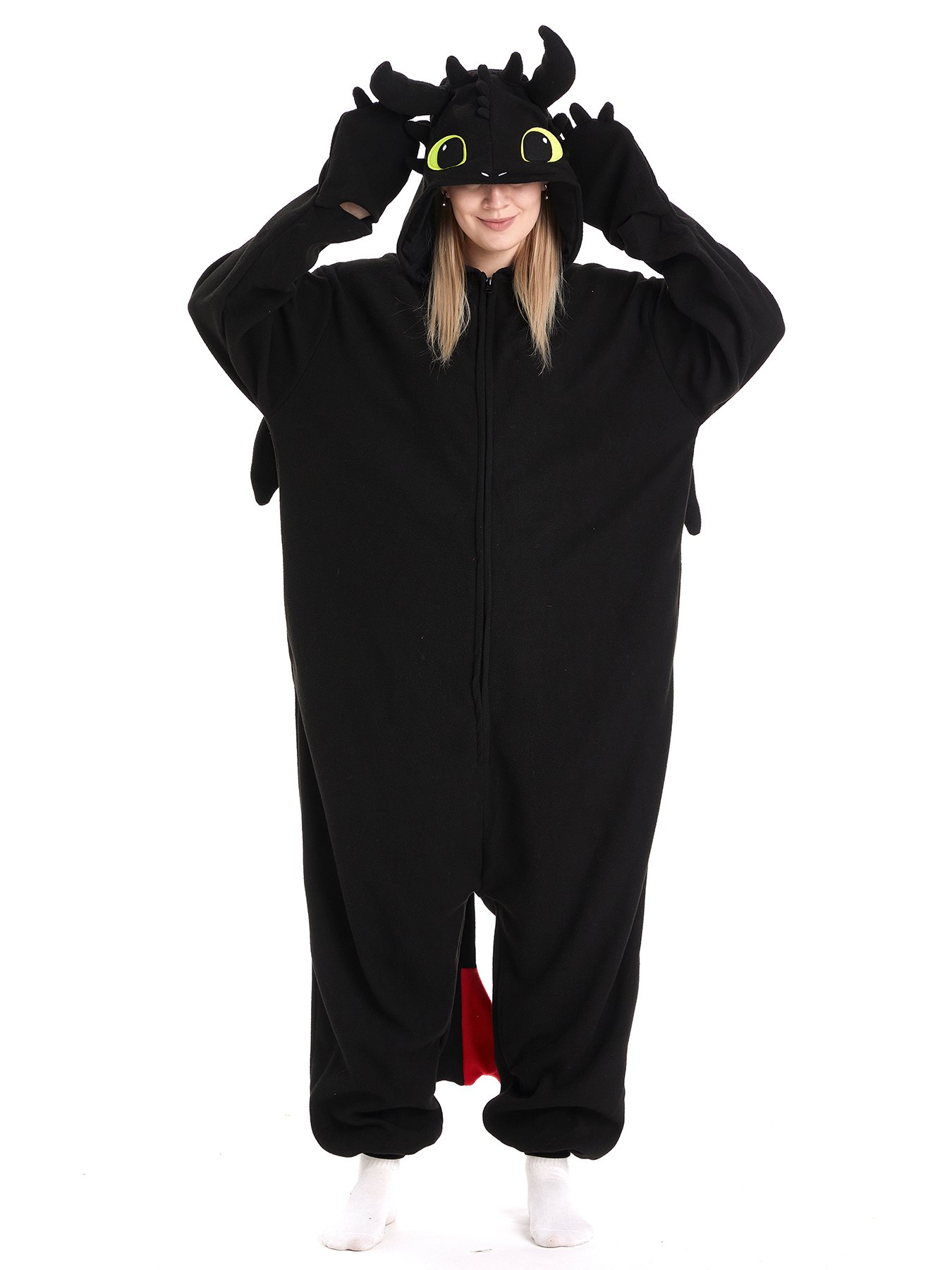 Adult model wearing a black winged dragon onesie, front view